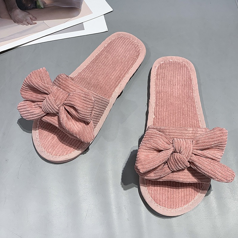 Las chancletas planas del arco c&oacute;modo de la tendencia de la moda de las mujeres al por mayor de la primavera y del oto&ntilde;o se dirigen los deslizadores de la tela