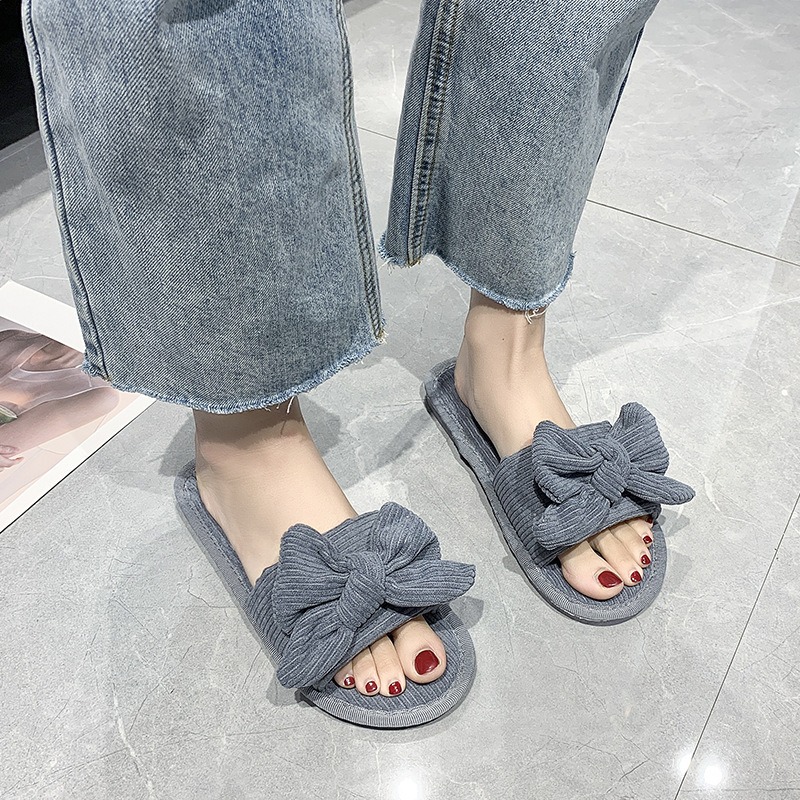 Las chancletas planas del arco c&oacute;modo de la tendencia de la moda de las mujeres al por mayor de la primavera y del oto&ntilde;o se dirigen los deslizadores de la tela