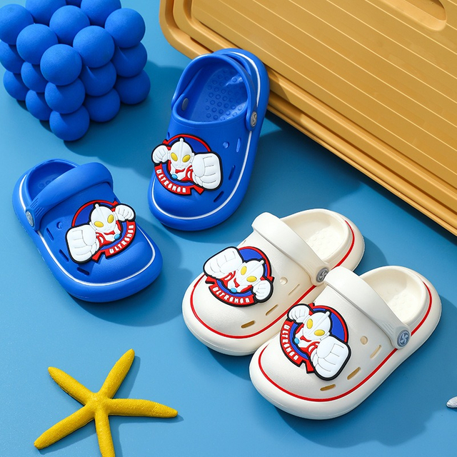 Precioso lazo de dibujos animados antideslizante suave niños jardín pie desgaste zapatillas niños zuecos zapatos para el verano